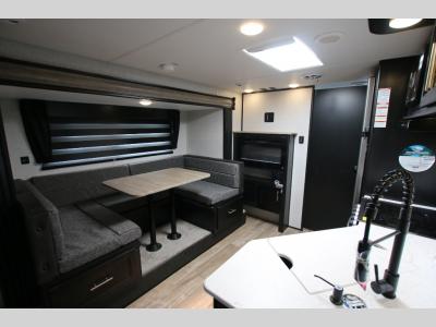 Cherokee RV U Shaped Dinette and TV Area With Fireplace