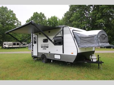 Awning and Mounted Propane Tank With Tent Beds Out