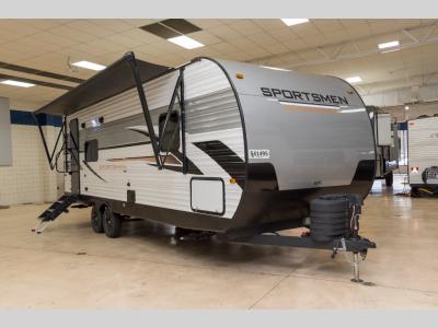 Front view of 2025 KZ Sportsmen SE 241RKSE travel trailer with awning extended