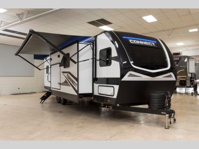 Front-side view of 2025 KZ Connect C323MKK parked at Motor Sportsland
