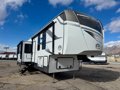 Angled front view of 2025 Forest River Sandpiper 4002FB fifth wheel at Motor Sportsland