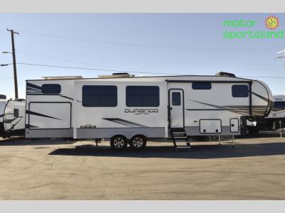 Full curbside exterior profile of the fifth wheel with slides out