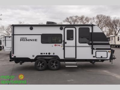 Side profile showing dual axles, windows, and clean exterior lines