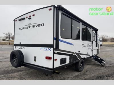 Rear passenger-side corner with spare tire and door view