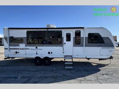 Full curbside exterior view with slides extended and panoramic windows visible