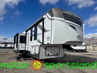 Angled front view of 2025 Forest River Sandpiper 4002FB fifth wheel at Motor Sportsland