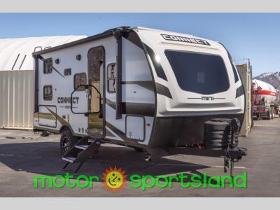 Front angle of 2025 KZ Connect Mini CM191BHK travel trailer with LED-lit cap and logo