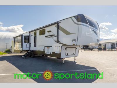 Angled front view of 2025 Forest River RV Sandpiper 3900HBLR fifth wheel at Motor Sportsland
