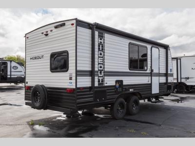 Rear curbside angle with full vertical rear siding and spare tire