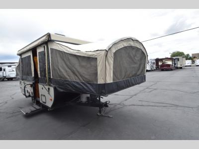 Passenger side view of the 2016 Starcraft Comet 1222 pop-up camper for sale at Motor Sportsland