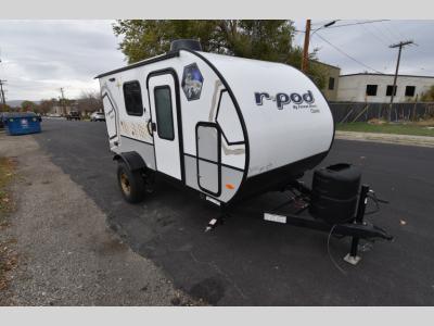 Front angle showing curbside entry door and aerodynamic teardrop shape.