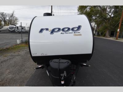 Head-on front view of the R Pod RP-107C with diamond plate rock guard and dual propane tanks.