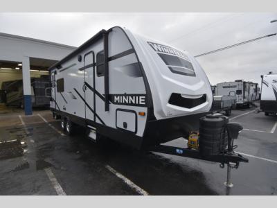 2024 Winnebago Minnie 2529RG front angle view with bold graphics