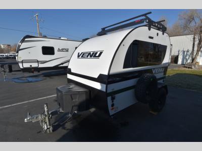 Side angle showing rugged off-road tires on Venu 10KB