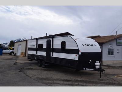 Front passenger side view of 2024 Viking 26BH travel trailer with entry door and steps