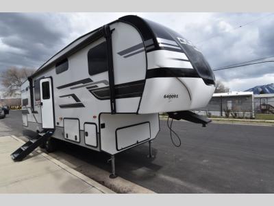 Front-side view of 2024 KZ Durango Half-Ton D240RKD fifth wheel with molded cap