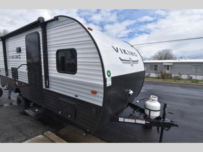 Front angle view of 2024 Viking 18DBS travel trailer with entry door and propane