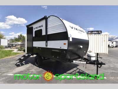 Front passenger side view of 2024 Viking Saga 14SR travel trailer with black and silver body