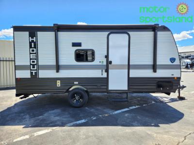 Side view showing single axle and main entry door