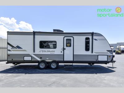 Curbside full-length view with entry door and awning