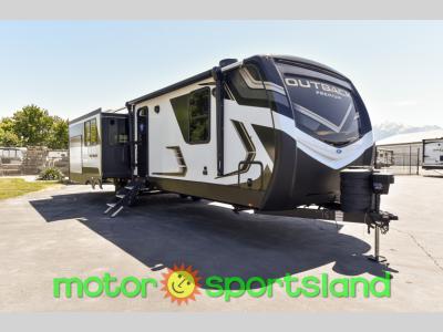 Passenger front angle of 2024 Keystone Outback 330RL travel trailer for sale