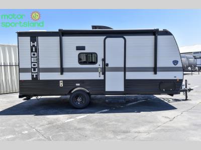 Curbside view showing entry door and compact frame