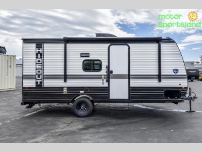 Curbside profile of the trailer showing door and compact frame