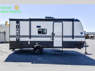 Curbside profile showing entry door and compact single-axle frame
