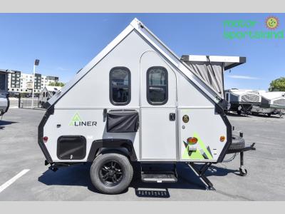 Curbside profile showing door, windows, and bunk signage