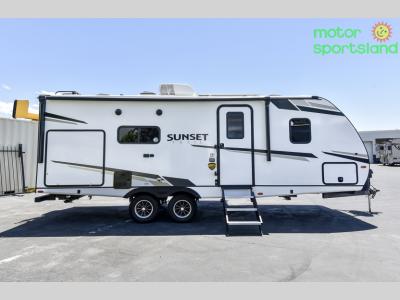 Full passenger side profile showing entry door, awning, and slide