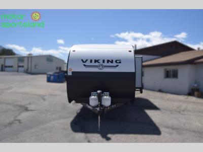 Head-on front view showing dual propane tanks and aerodynamic cap