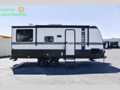 Driver-side exterior profile of Hideout Sport with dual axles and clean white finish