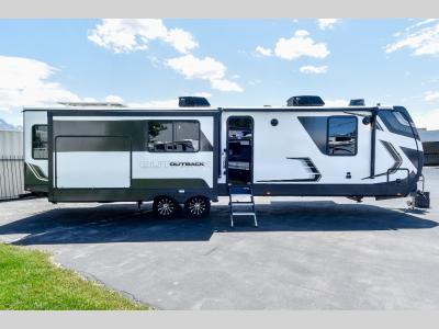 Front passenger side view of 2024 Keystone Outback 330RL luxury travel trailer for sale