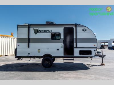 Passenger side exterior view with single axle and entry door