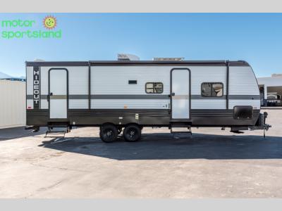 Full side profile showing entry door and large windows on Hideout 261BH