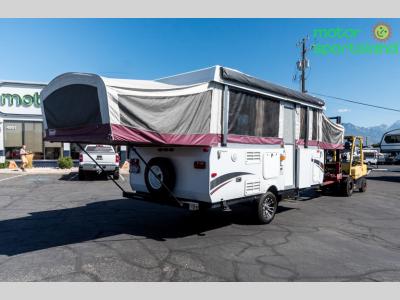 Rear angle showing slideout dinette and full canvas setup