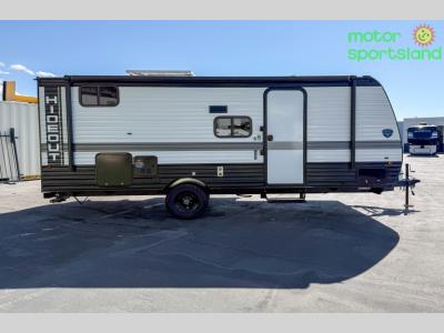 Full curbside profile with entry door and power awning visible