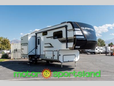 Front angle of the 2024 KZ Durango D321RKT fifth wheel showing aerodynamic profile and dual-tone graphics.