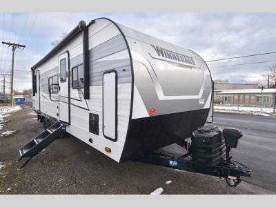 Front angle of 2024 Winnebago Access 28FK travel trailer with extended tongue jack