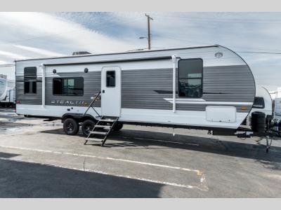 Side profile showing dual axles, and graphic accents