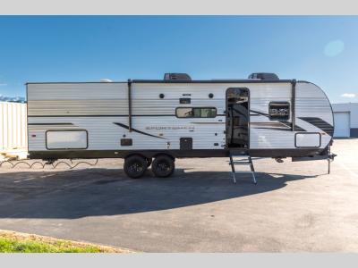 Passenger side with entry door, awning, and slideout extended