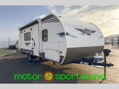Front angle of 2021 Forest River Shasta 18FQ travel trailer with white siding and diamond plate trim