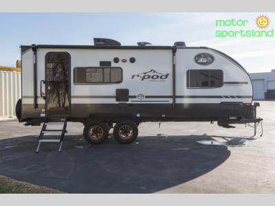 Side profile showcasing the entry door and awning