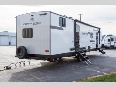 Rear corner showing roof ladder and spare tire