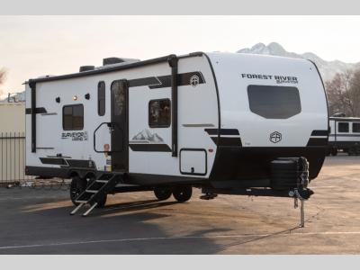Front angled passenger side view of 2025 Forest River Surveyor 265RBLE travel trailer for sale