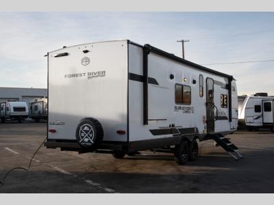 Rear driver-side corner showing back wall and roof ladder