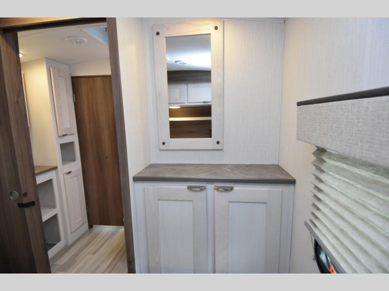 Second bathroom vanity view with framed mirror