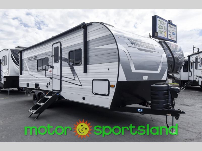 Front angle view of 2024 Winnebago Access 25ML parked on paved lot