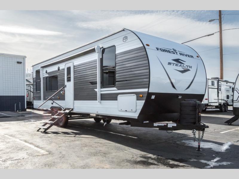 Passenger-side exterior view of the 2025 Forest River Stealth 2630SLE for sale