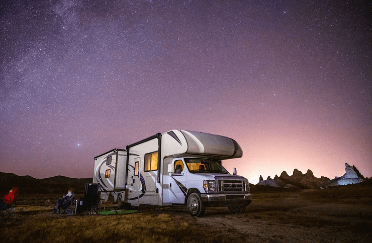 motorhome underneath a starry sky